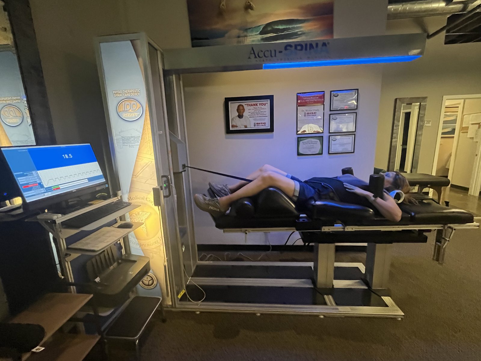 A patient receiving AccuSpina spinal decompression at Foudy Chiropractic